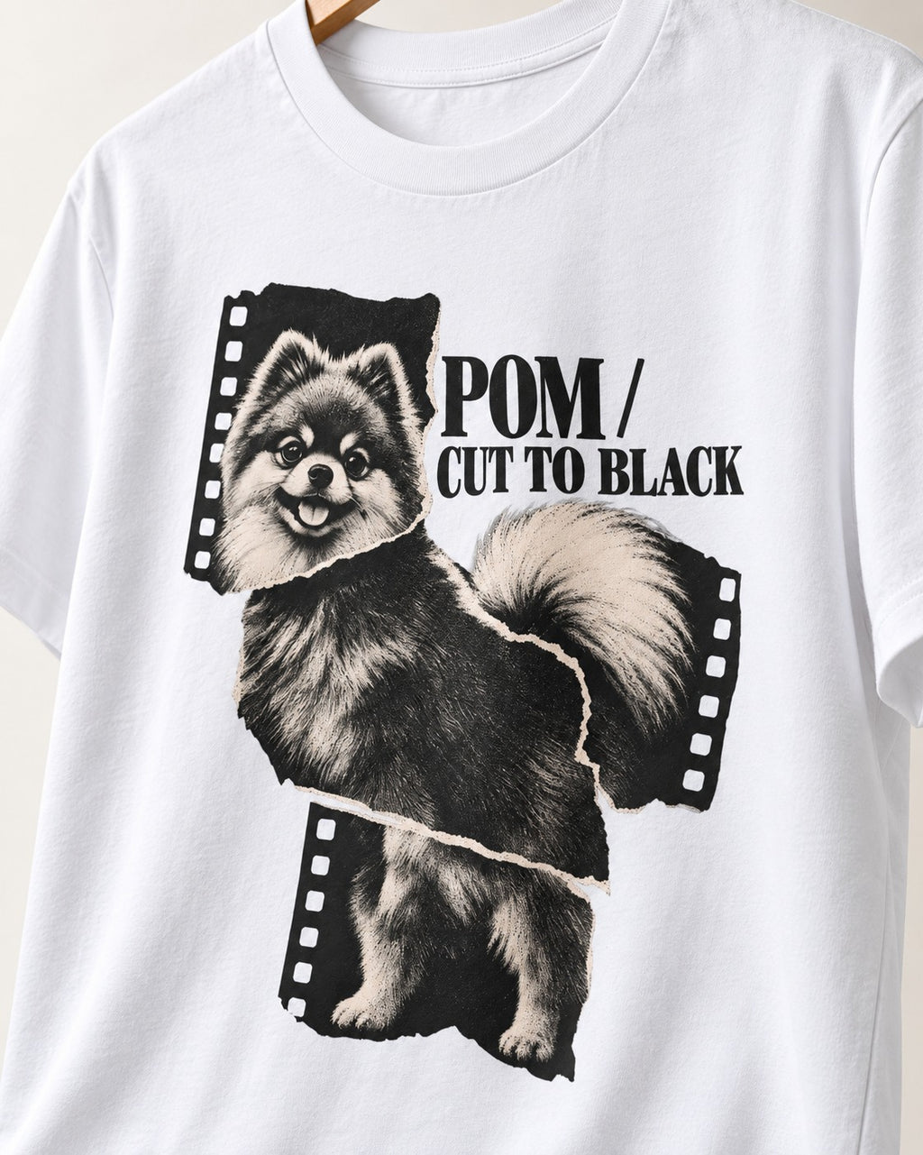 Pomeranian Cut to Black T-Shirt in White, close-up of the graphic