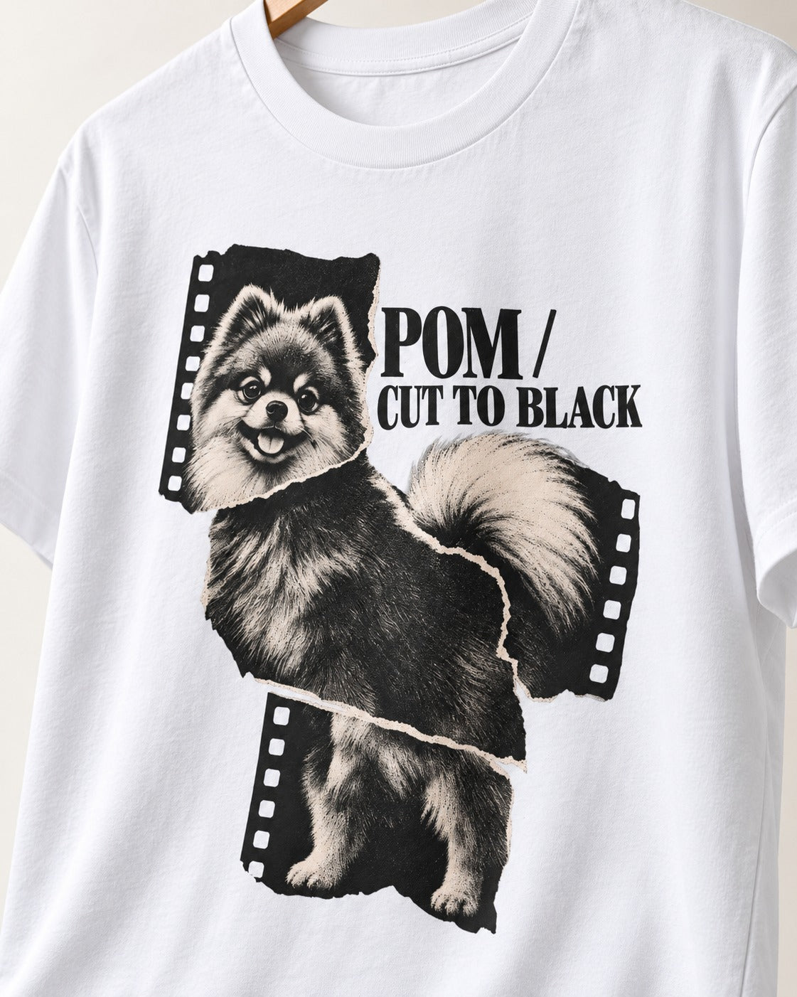 Pomeranian Cut to Black T-Shirt in White, close-up of the graphic