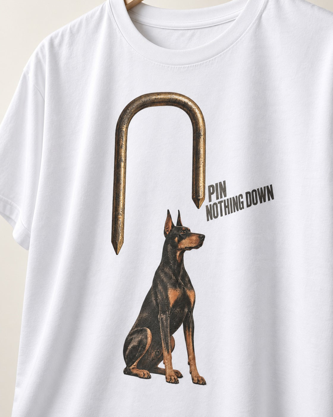 Nothing Pins Doberman Down T-Shirt in White, close-up of the graphic