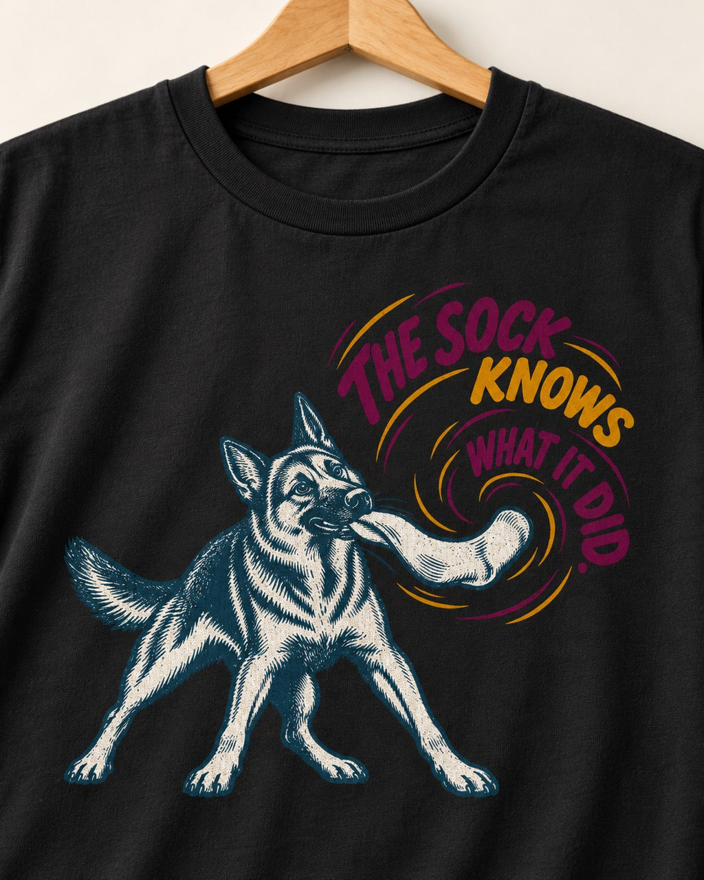 German Shepherd Dog The Sock Knows What I Did Graphic T-Shirt in Black, close-up of the graphic