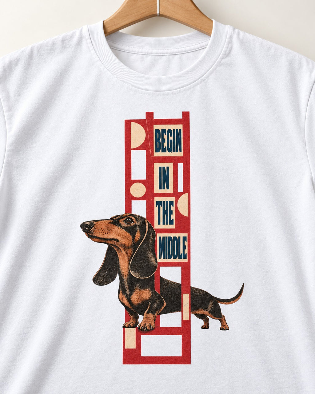 Dachshund Begins in the Middle T-Shirt in White, close-up of the graphic