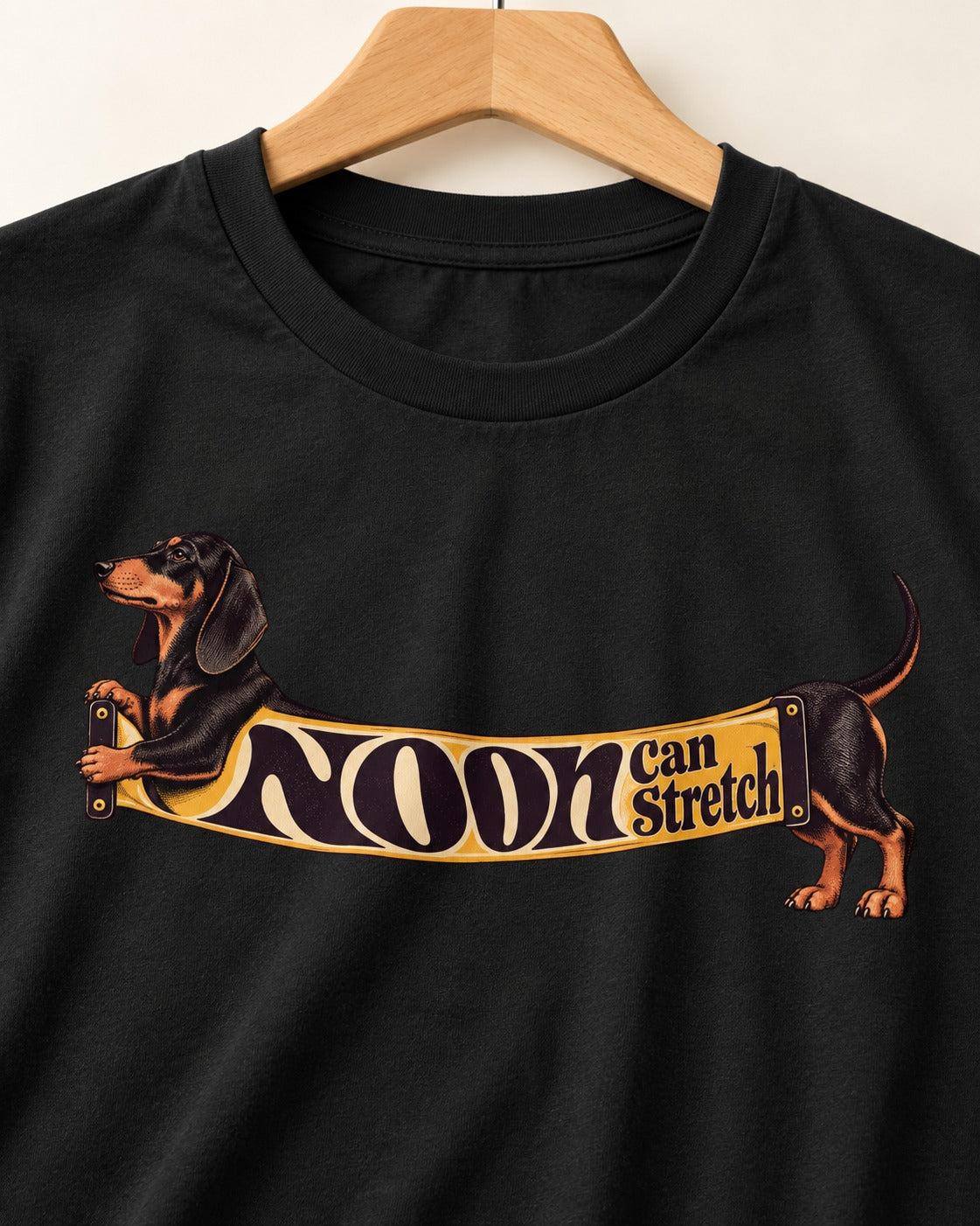 Dachshund Noon Can Stretch Sign Graphic T-Shirt in Black, close-up of the graphic