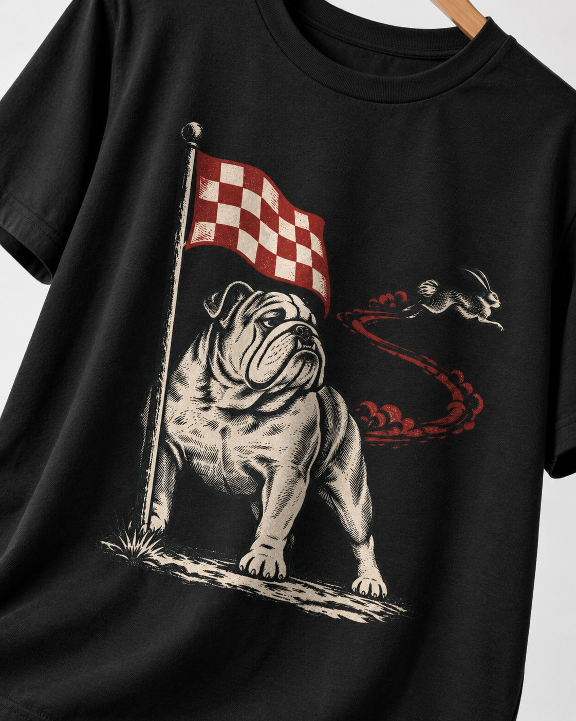 English Bulldog Checkered Flag Rabbit Chase T-Shirt in Black, close-up of the graphic