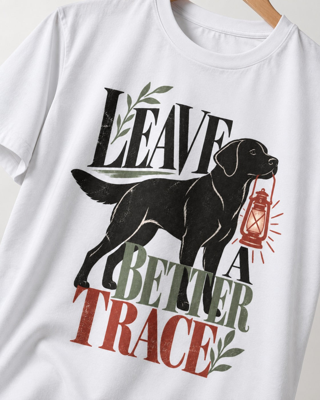 Leave a Better Trace Labrador Retriever T-Shirt in White, close-up of the graphic
