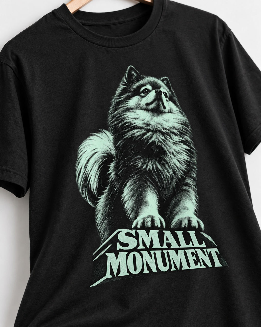 Pomeranian Small Monument Pedestal Graphic T-Shirt in Black, close-up of the graphic