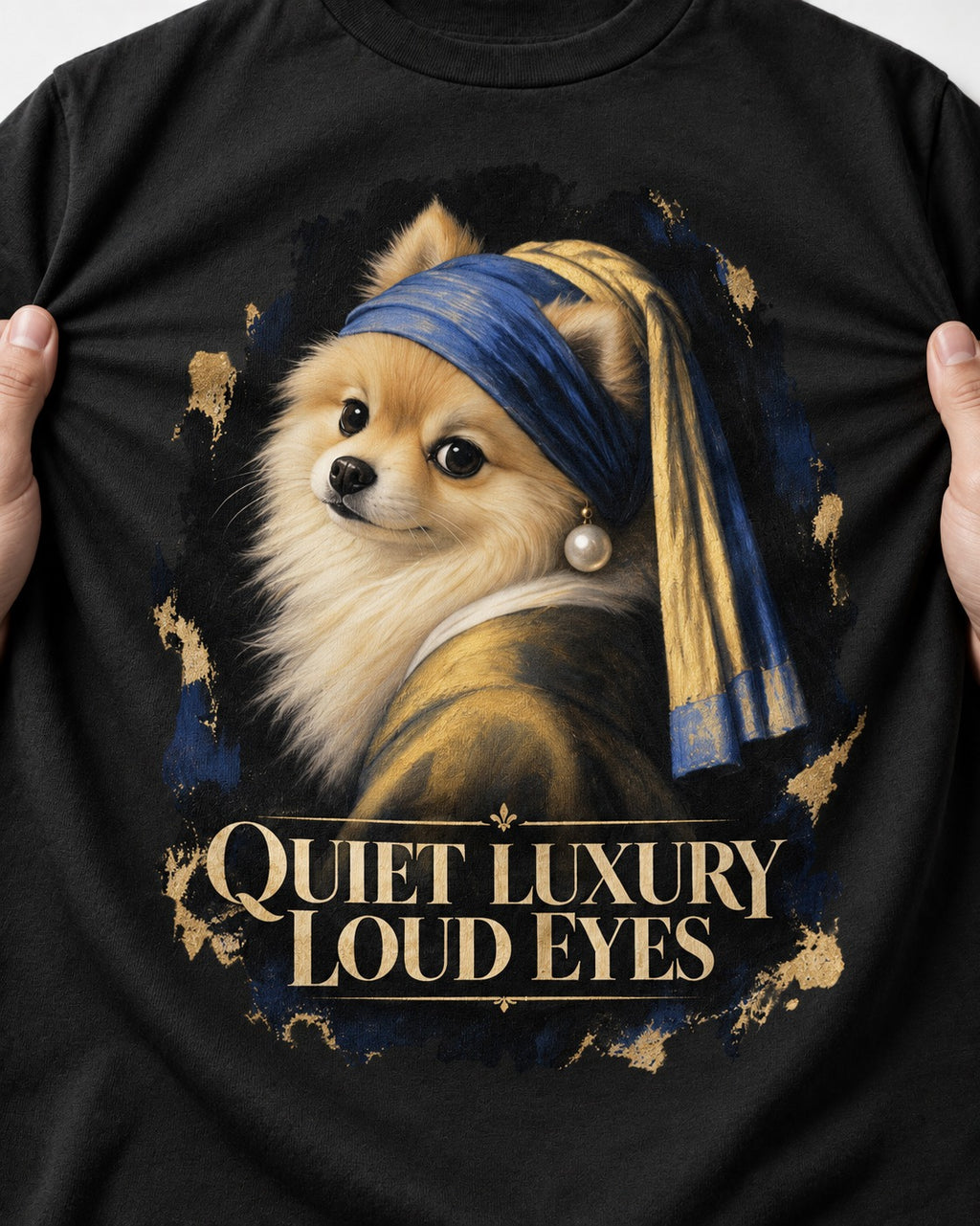 Pomeranian Quiet Luxury Loud Eyes Pearl Portrait Graphic T-Shirt in Black, close-up of the graphic