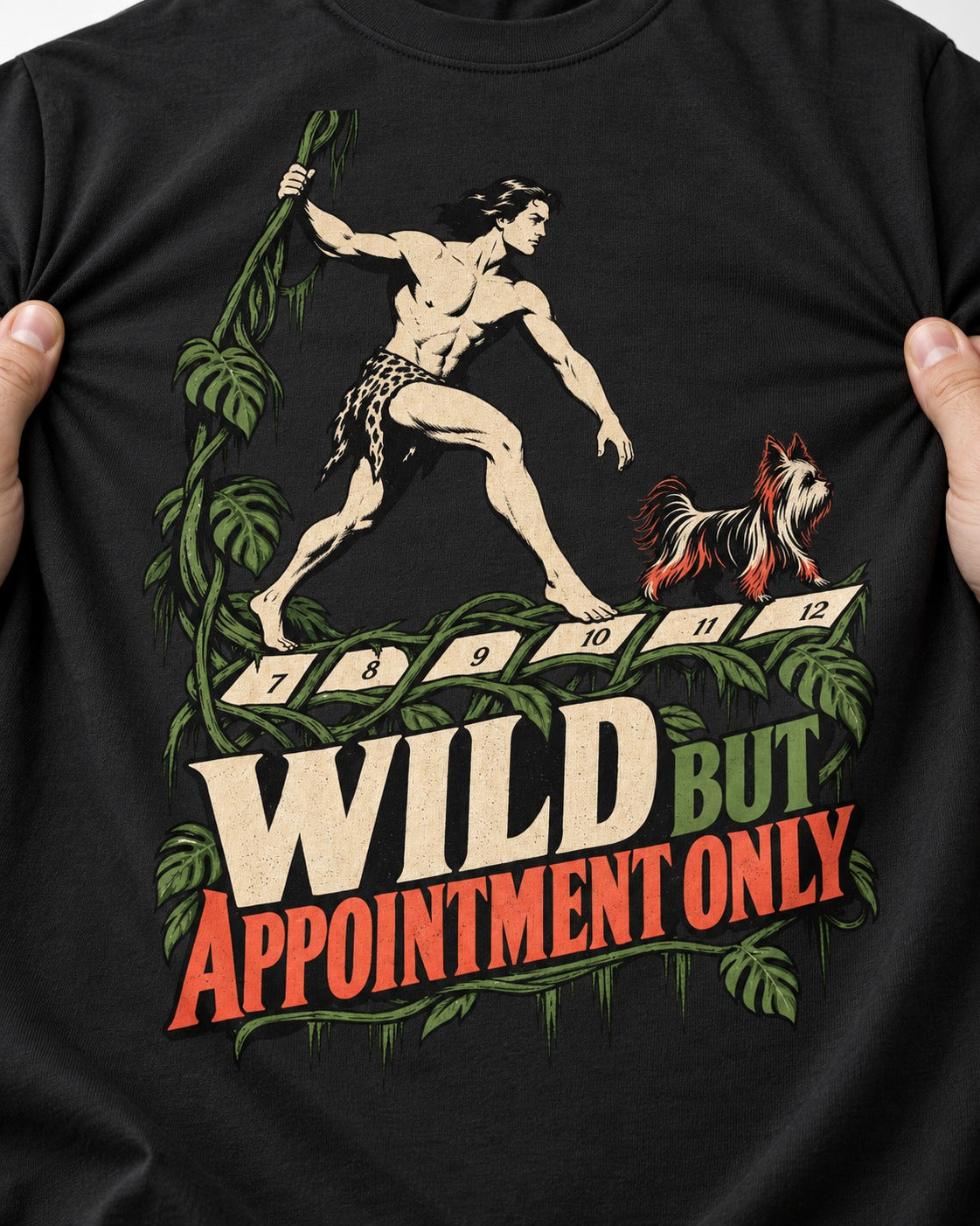Yorkshire Terrier Wild but Appointment Only Jungle Calendar Graphic T-Shirt in Black, close-up of the graphic
