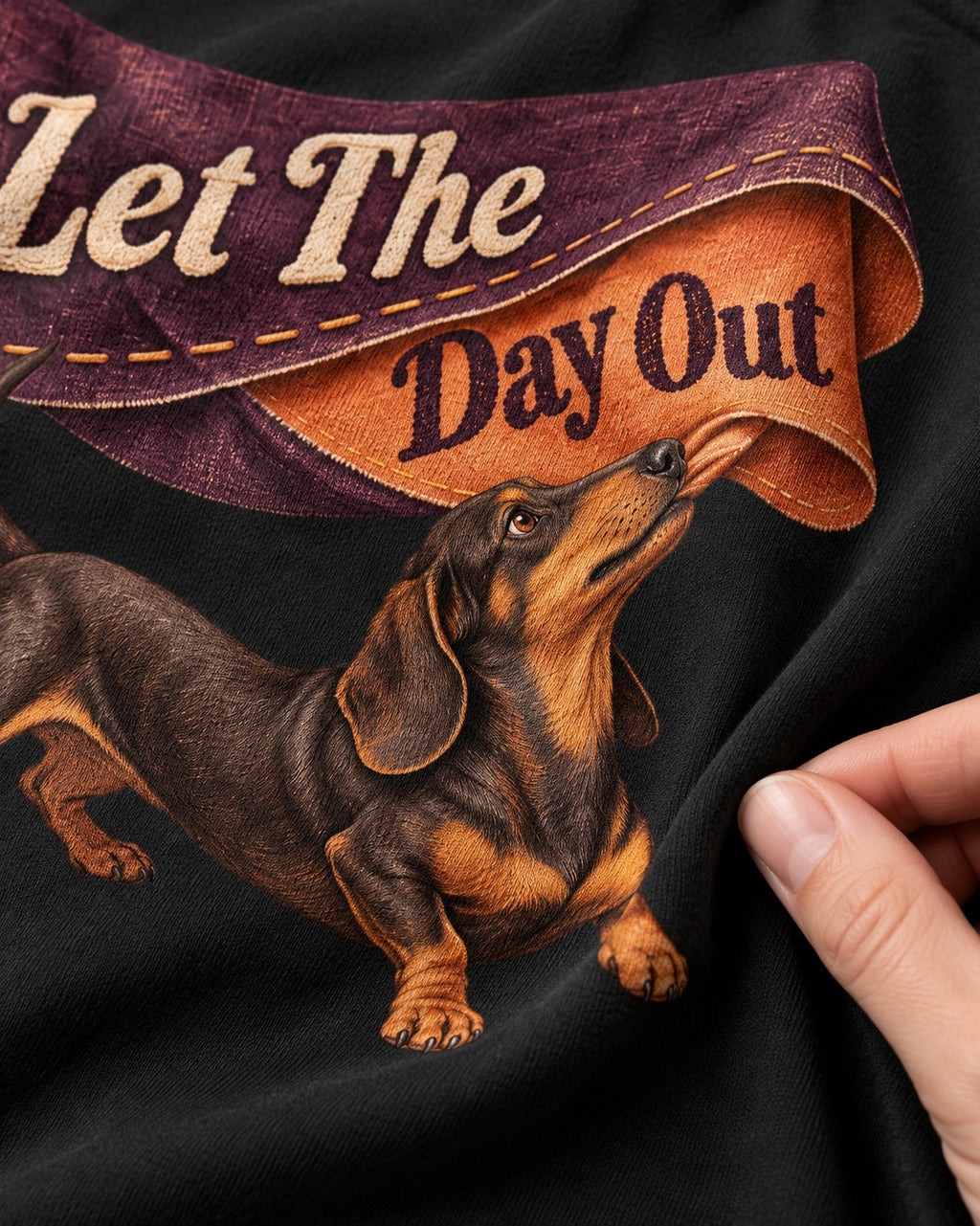 Dachshund Let The Day Out Fabric Banner Graphic T-Shirt in Black, close-up of the graphic