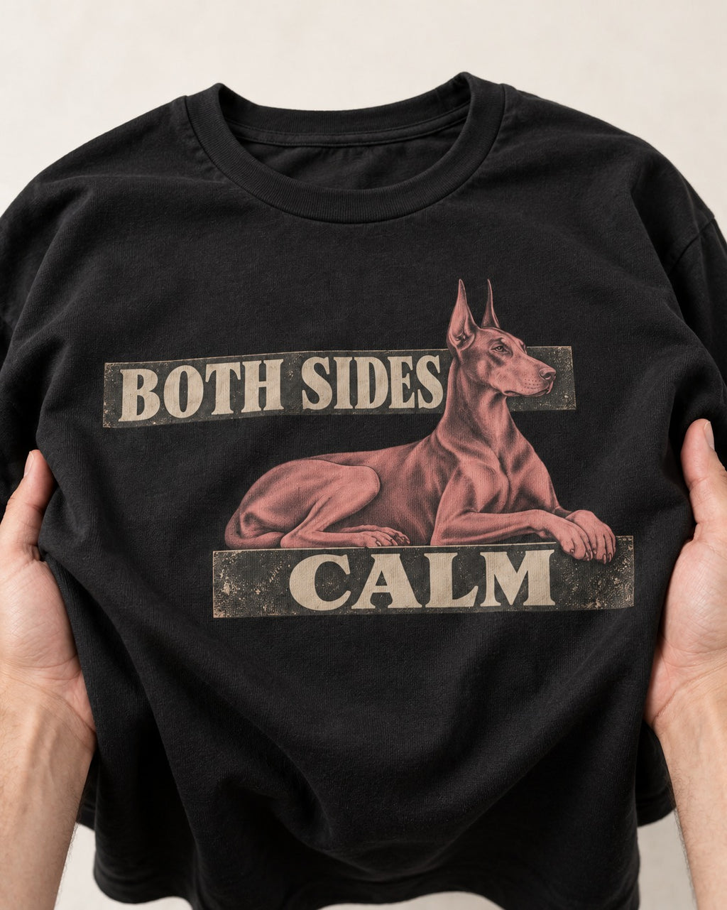 Doberman Both Sides Calm Banner T-Shirt in Black, close-up of the graphic