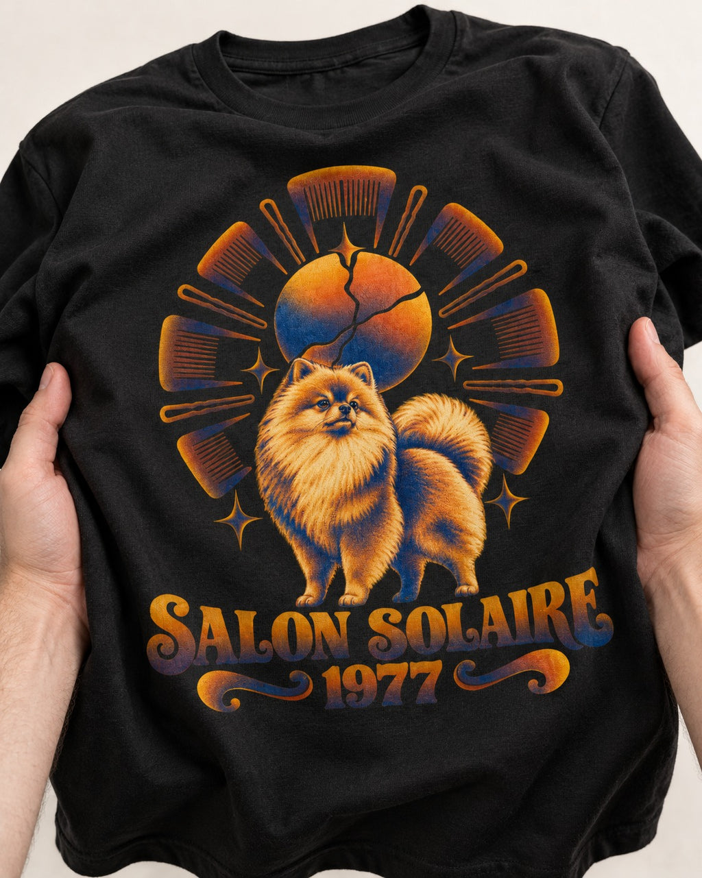 Pomeranian Salon Solaire 1977 Hairbrush Halo Graphic T-Shirt in Black, close-up of the graphic