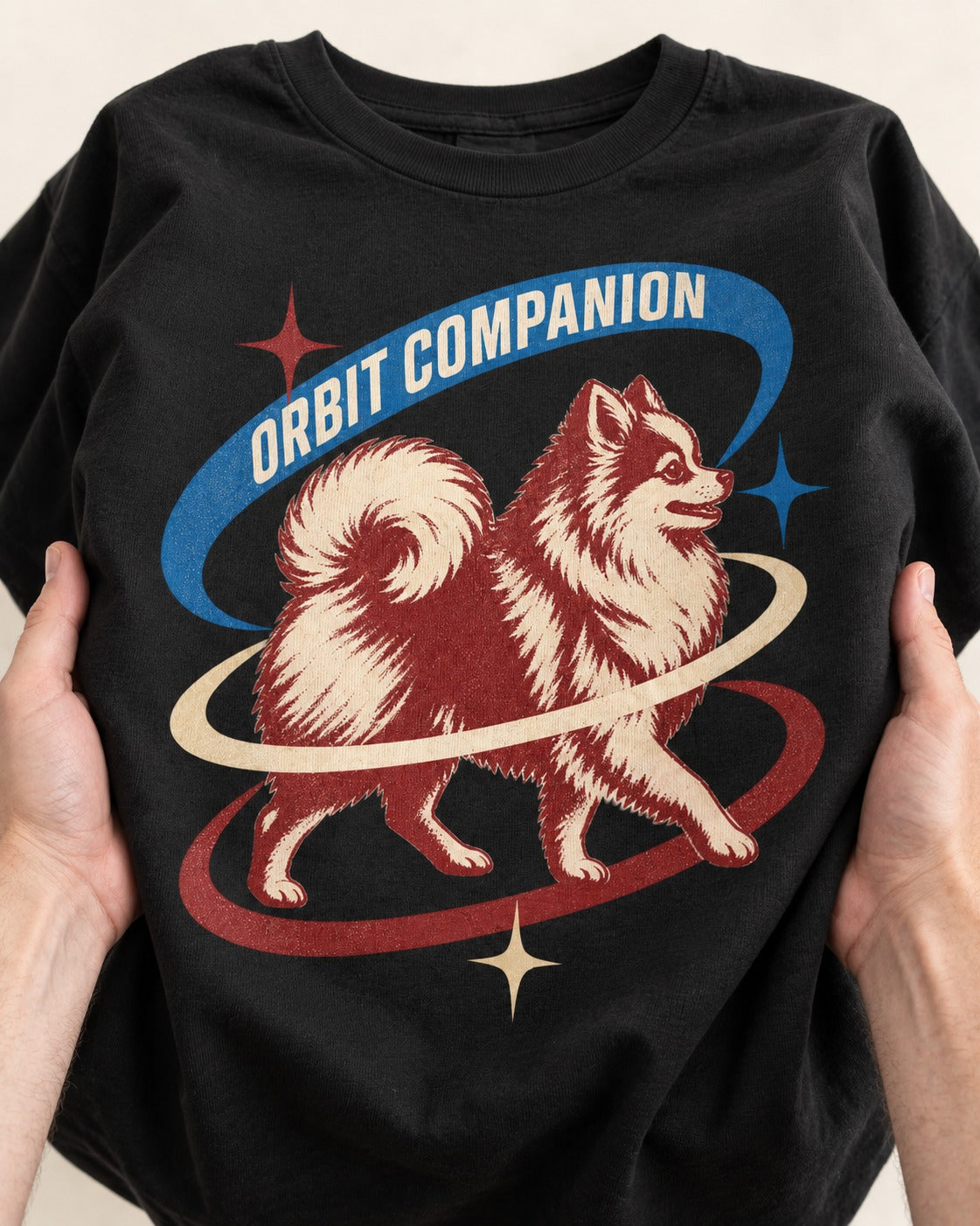 Pomeranian Orbit Companion Retro Space Graphic T-Shirt in Black, close-up of the graphic