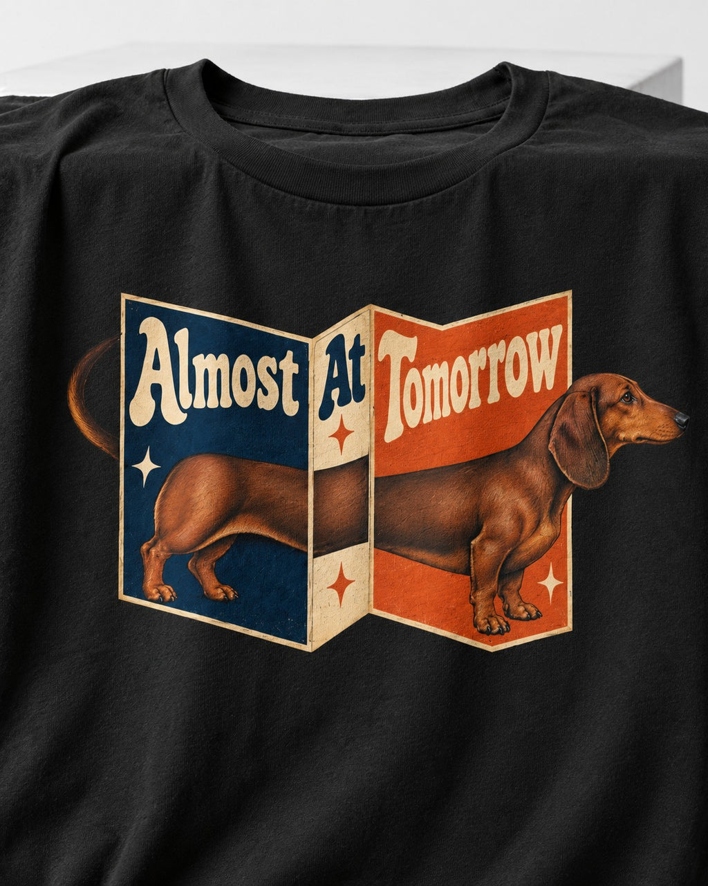 Dachshund Almost At Tomorrow Folding Screen Graphic T-Shirt in Black, close-up of the graphic