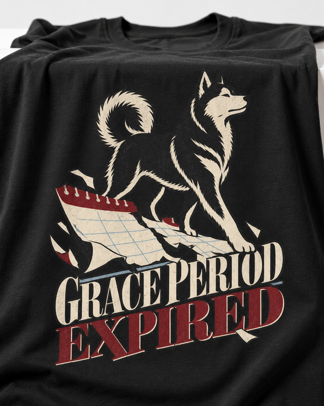 Husky Grace Period Expired Torn Calendar Graphic T-Shirt in Black, close-up of the graphic