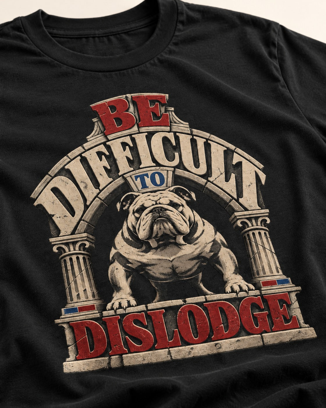 English Bulldog Be Difficult to Dislodge Stone Arch Graphic T-Shirt in Black, close-up of the graphic