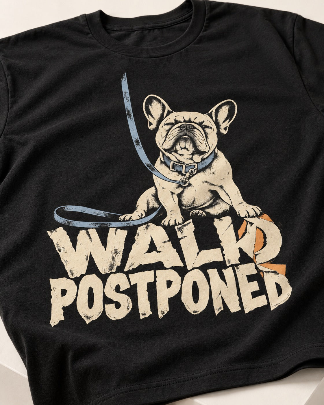 Frenchie Walk Postponed Leash Graphic T-Shirt in Black, close-up of the graphic