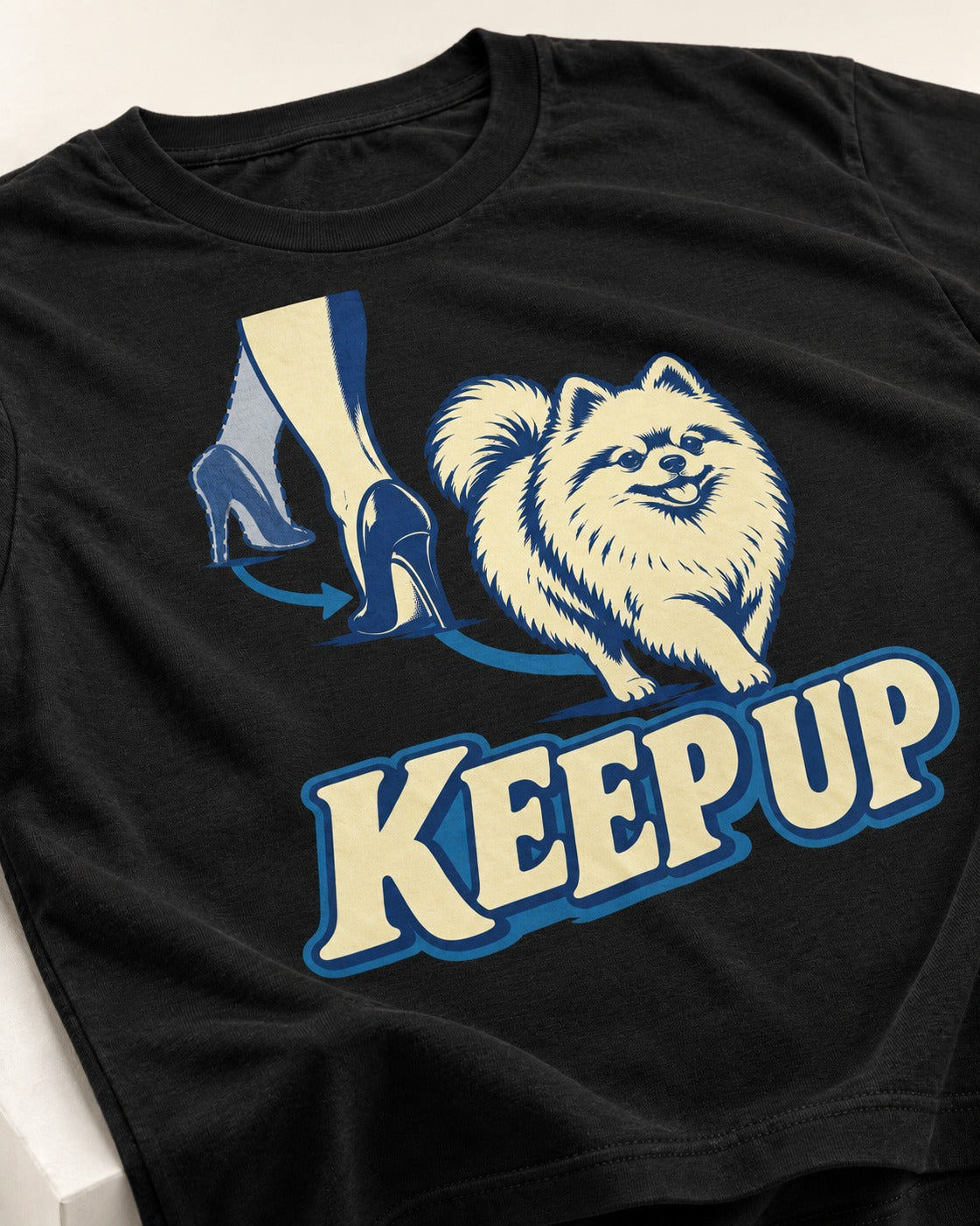 Pomeranian Keep Up High Heel Chase Graphic T-Shirt in Black, close-up of the graphic
