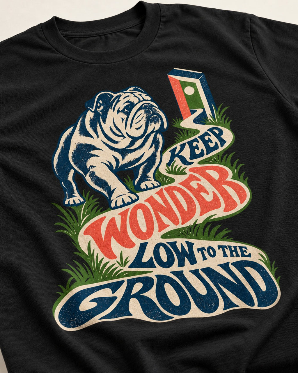 Keep Wonder Low to the Ground English Bulldog Graphic T-Shirt in Black, close-up of the graphic