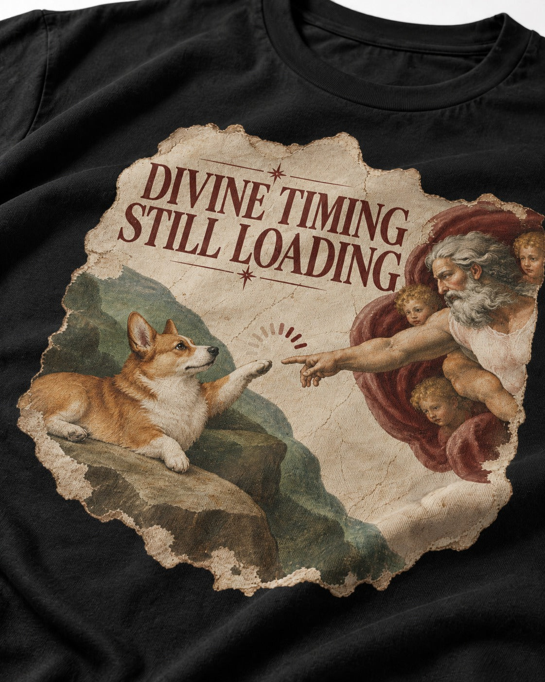 Corgi Divine Timing Still Loading Creation Parody T-Shirt in Black, close-up of the graphic