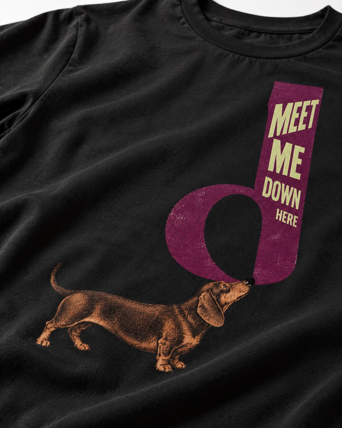 Dachshund Meet Me Down Here Letterform Loop Graphic T-Shirt in Black, close-up of the graphic
