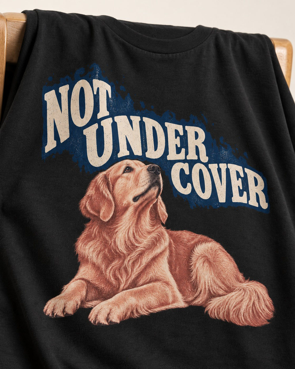 Not Under Cover Reclining Golden Retriever Graphic T-Shirt in Black, close-up of the graphic