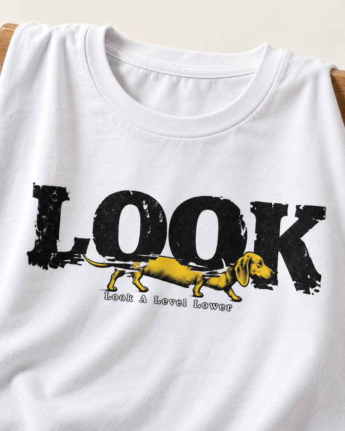 Look Lower for Dachshund T-Shirt in White, close-up of the graphic
