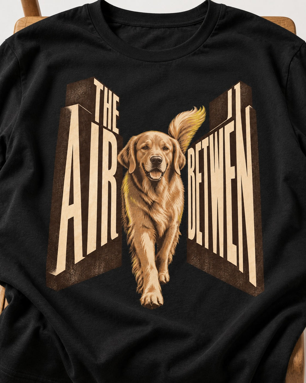 The Air Between Dimensional Golden Retriever Graphic T-Shirt in Black, close-up of the graphic
