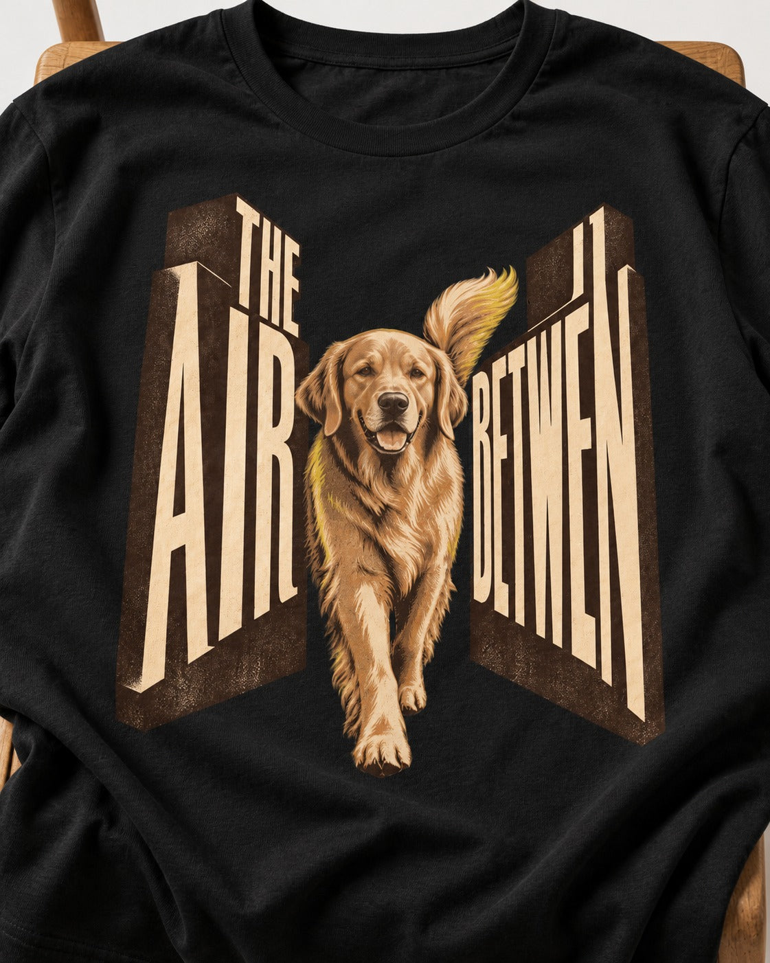 The Air Between Dimensional Golden Retriever Graphic T-Shirt in Black, close-up of the graphic