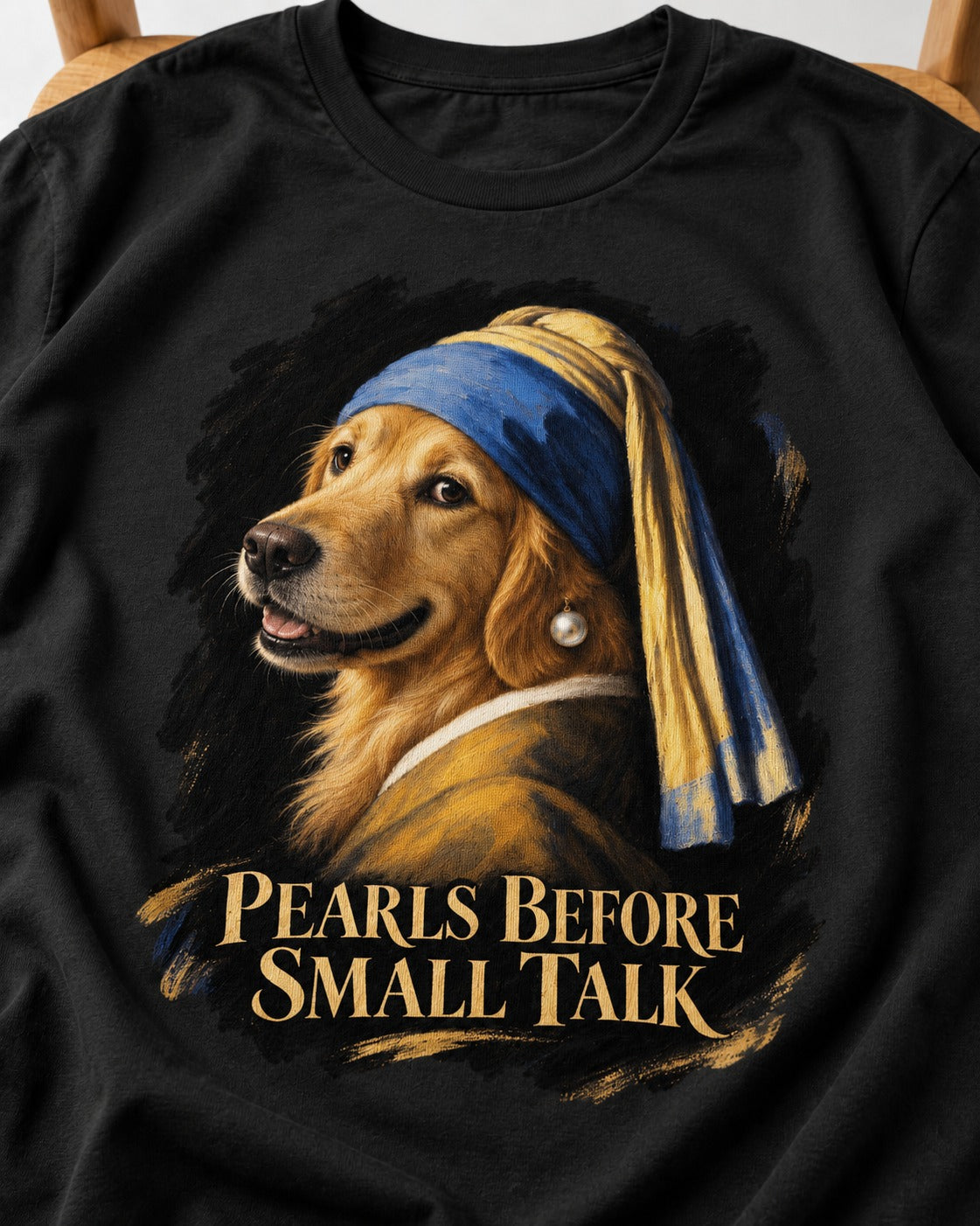 Pearls Before Small Talk Pearl Portrait Golden Retriever Graphic T-Shirt in Black, close-up of the graphic