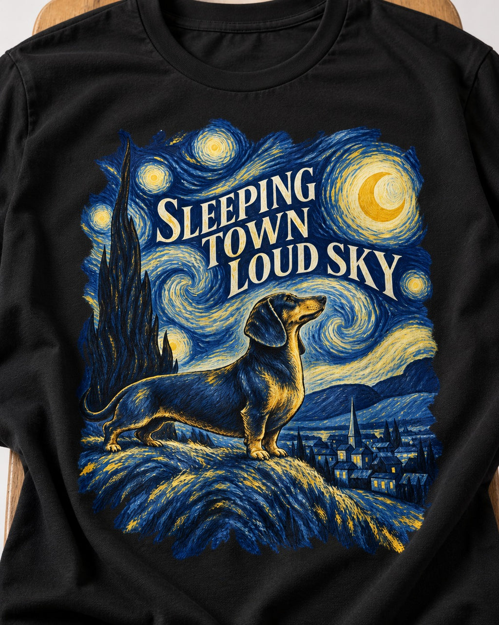 Dachshund Sleeping Town Loud Sky Starry Night Graphic T-Shirt in Black, close-up of the graphic