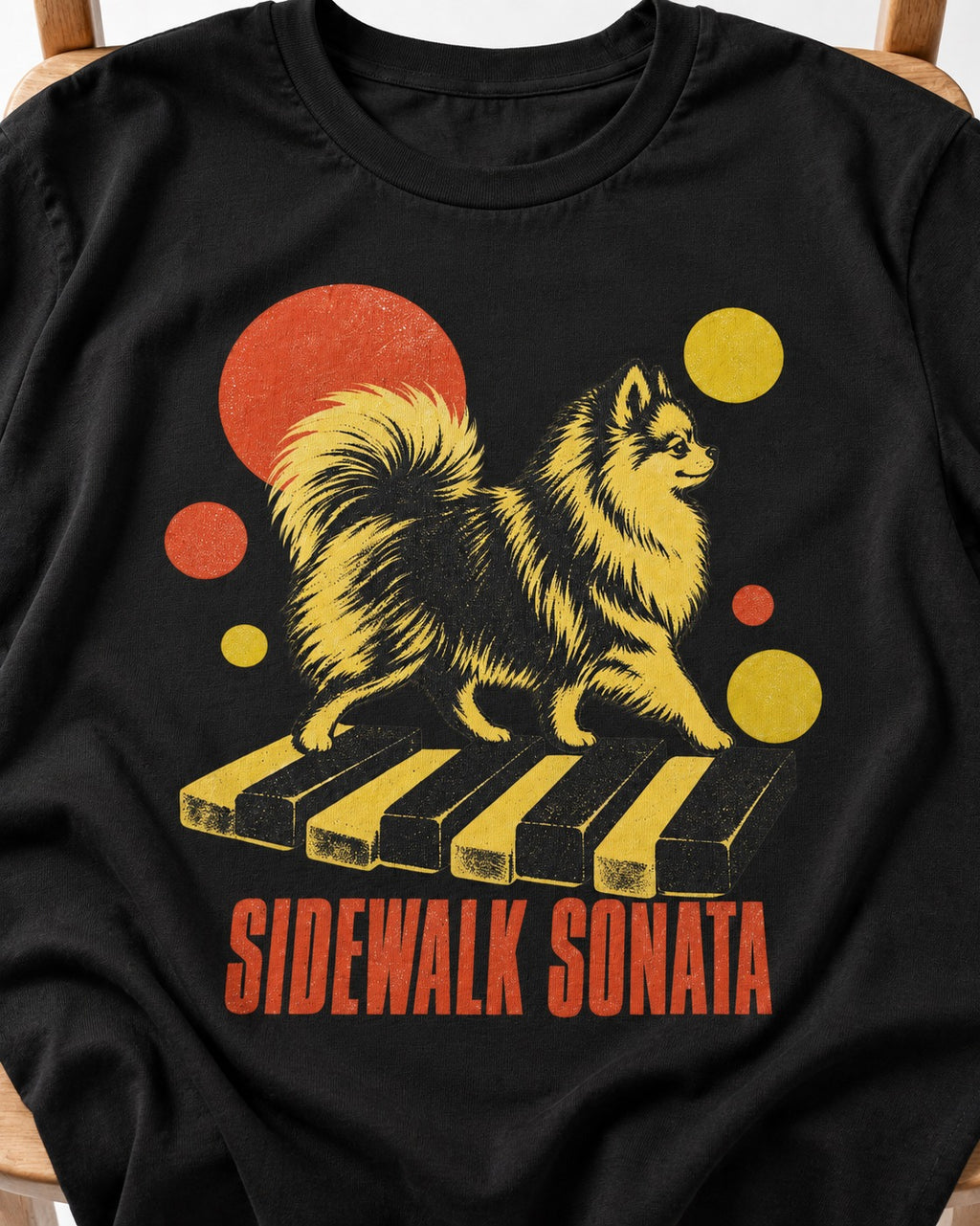 Pomeranian Sidewalk Sonata Piano Graphic T-Shirt in Black, close-up of the graphic