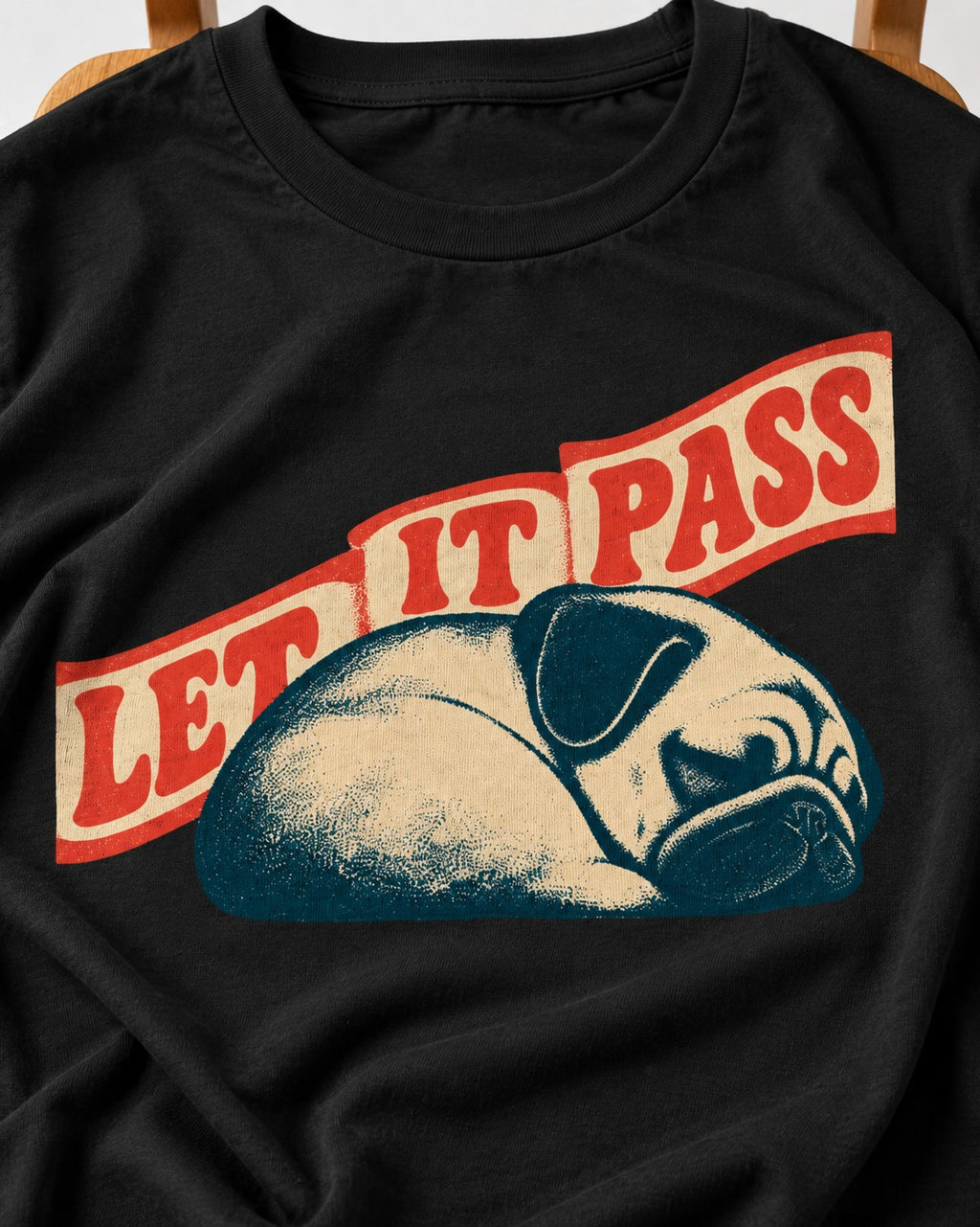 Pug Let It Pass Sleeping Banner Graphic T-Shirt in Black, close-up of the graphic