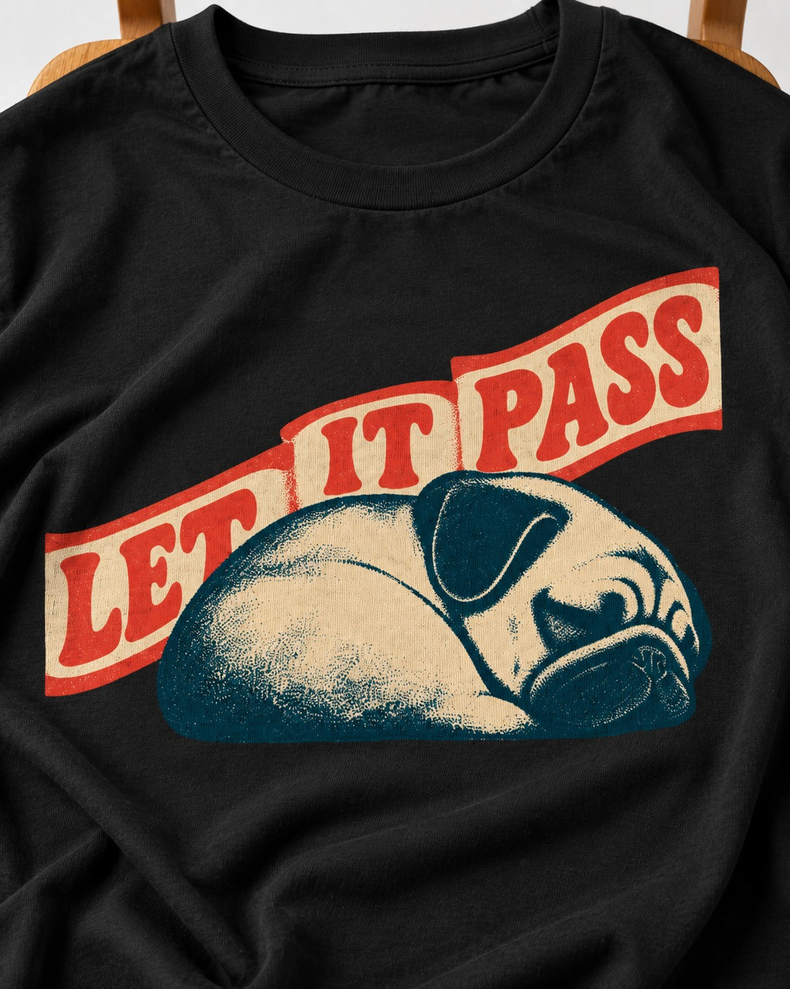 Pug Let It Pass Sleeping Banner Graphic T-Shirt in Black, close-up of the graphic