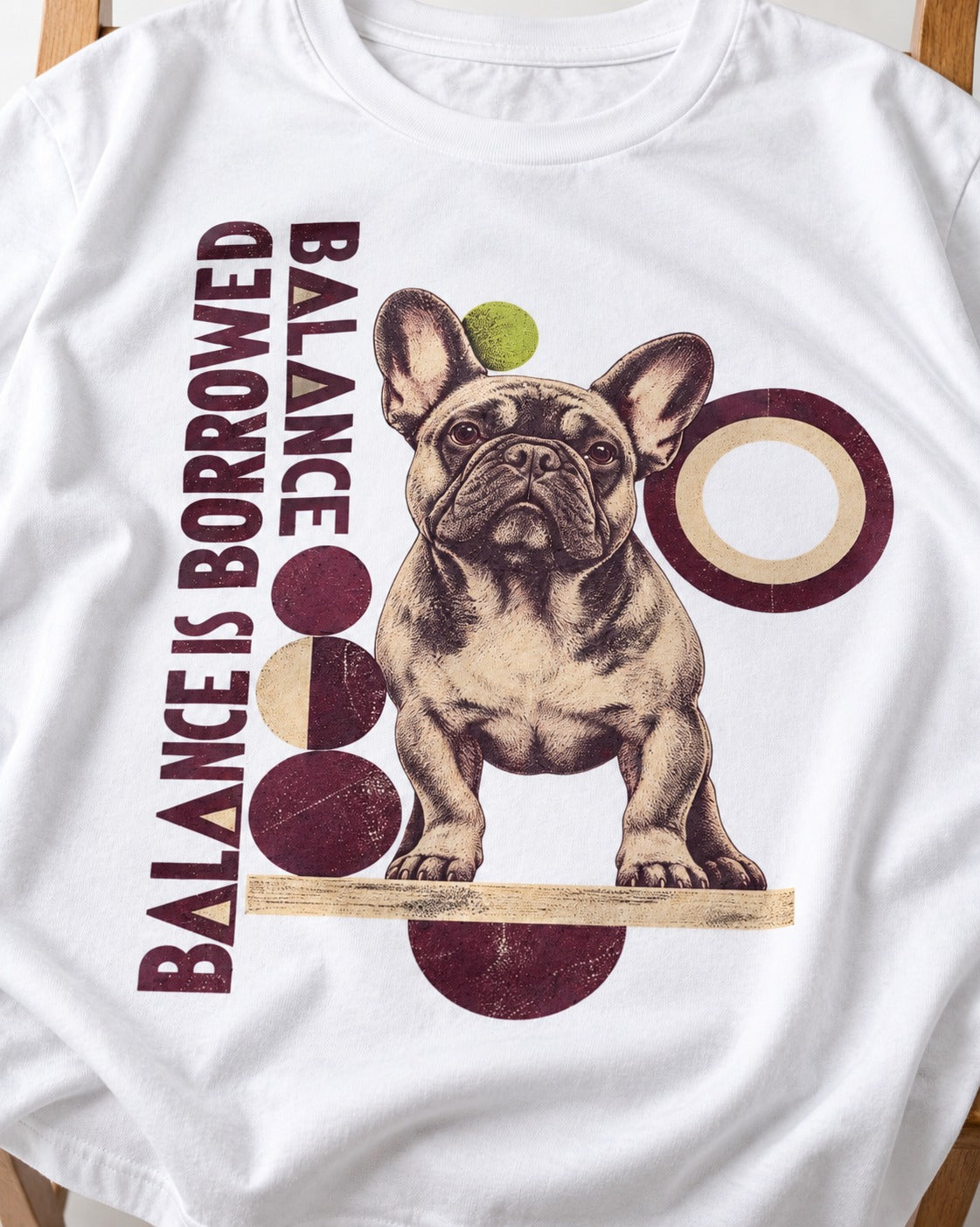 Frenchie's Balance Is Borrowed T-Shirt in White, close-up of the graphic