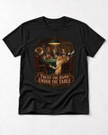 Pomeranian Trust the Hand Under the Table Poker Dogs Graphic T-Shirt in Black, flat lay product photo