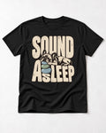Frenchie Sound Asleep Stone Pillow Graphic T-Shirt in Black, flat lay product photo