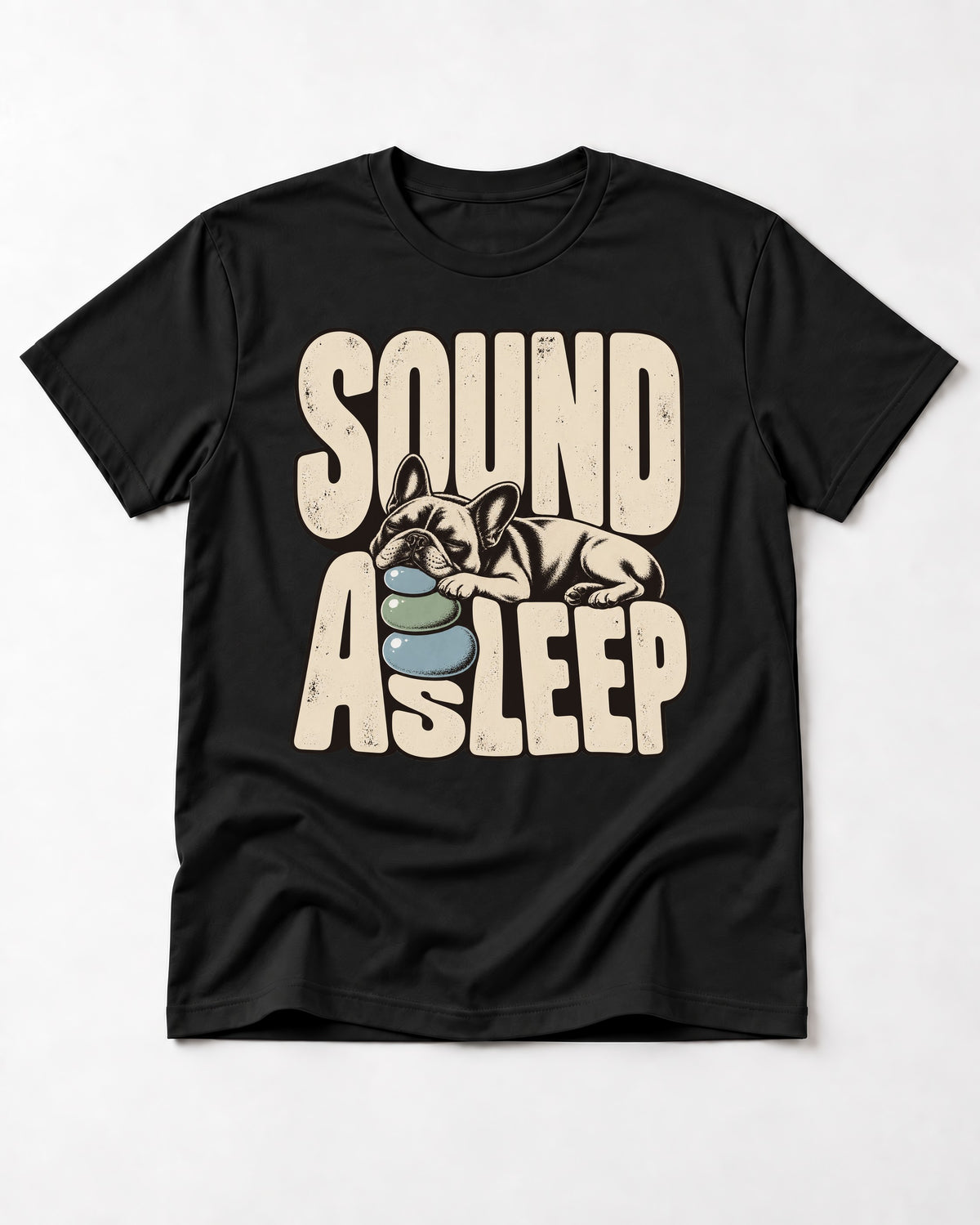 Frenchie Sound Asleep Stone Pillow Graphic T-Shirt in Black, flat lay product photo