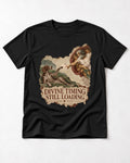 German Shorthaired Pointer Divine Timing Still Loading Creation Scene Graphic T-Shirt in Black, flat lay product photo