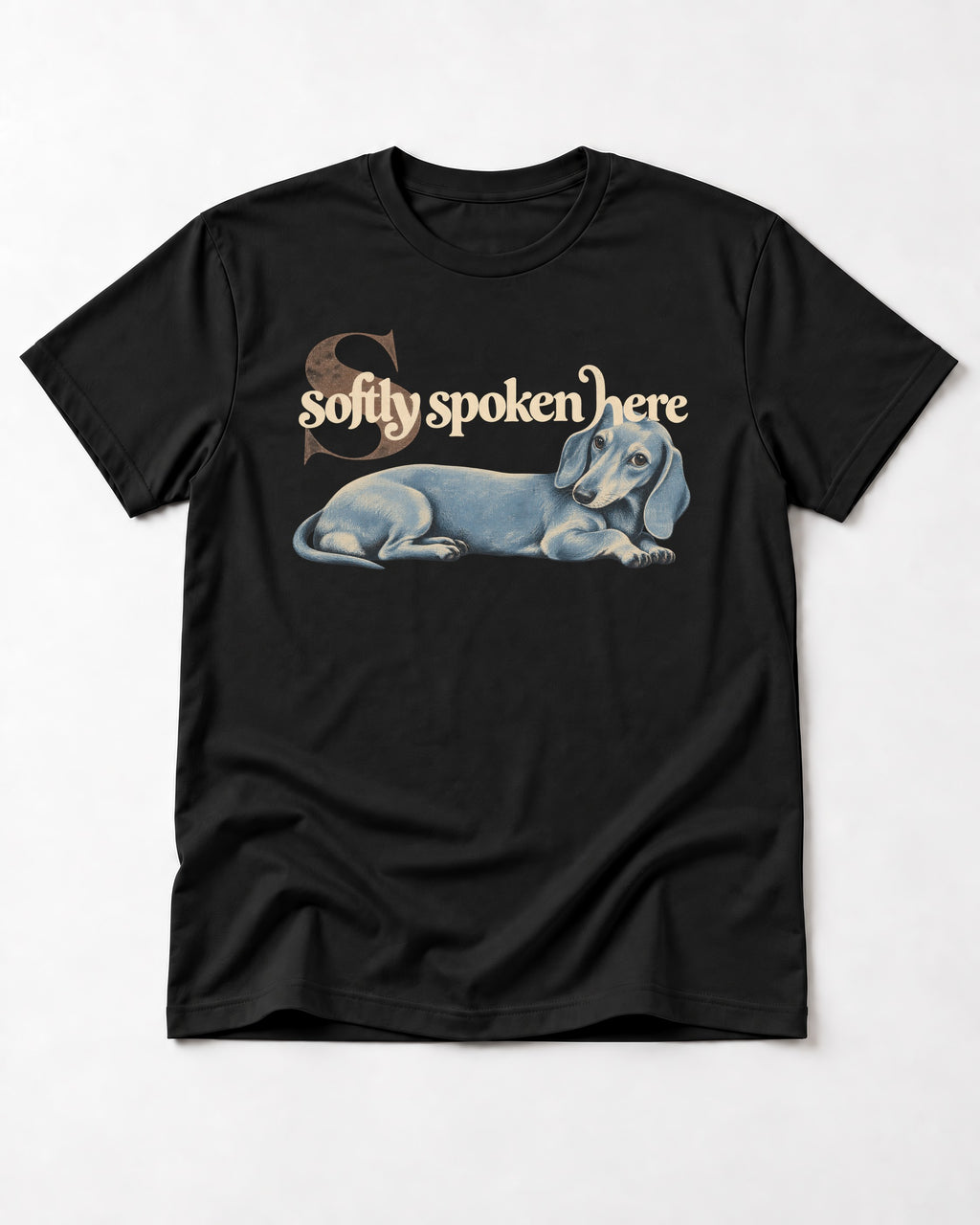 Dachshund Softly Spoken Here Reclining Portrait Graphic T-Shirt in Black, flat lay product photo