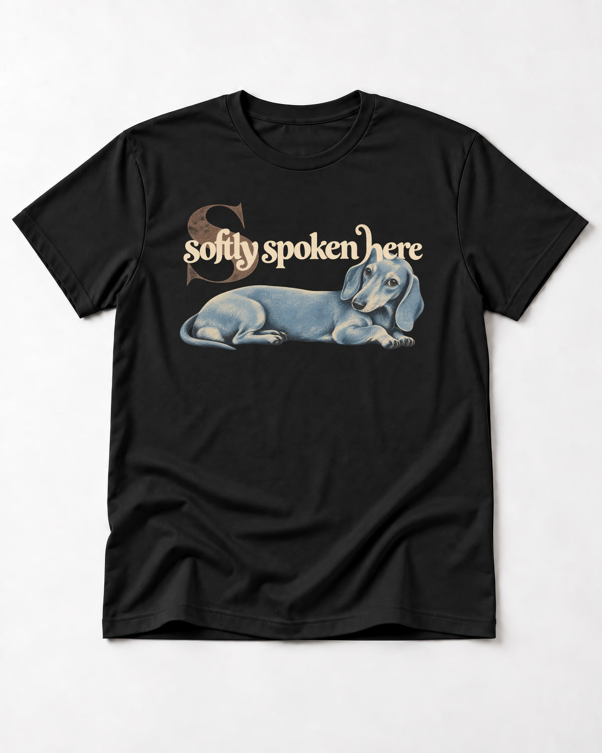 Dachshund Softly Spoken Here Reclining Portrait Graphic T-Shirt in Black, flat lay product photo