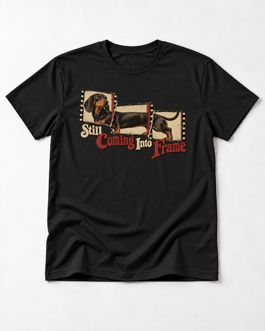 Dachshund Still Coming Into Frame Vintage Filmstrip Graphic T-Shirt in Black, flat lay product photo