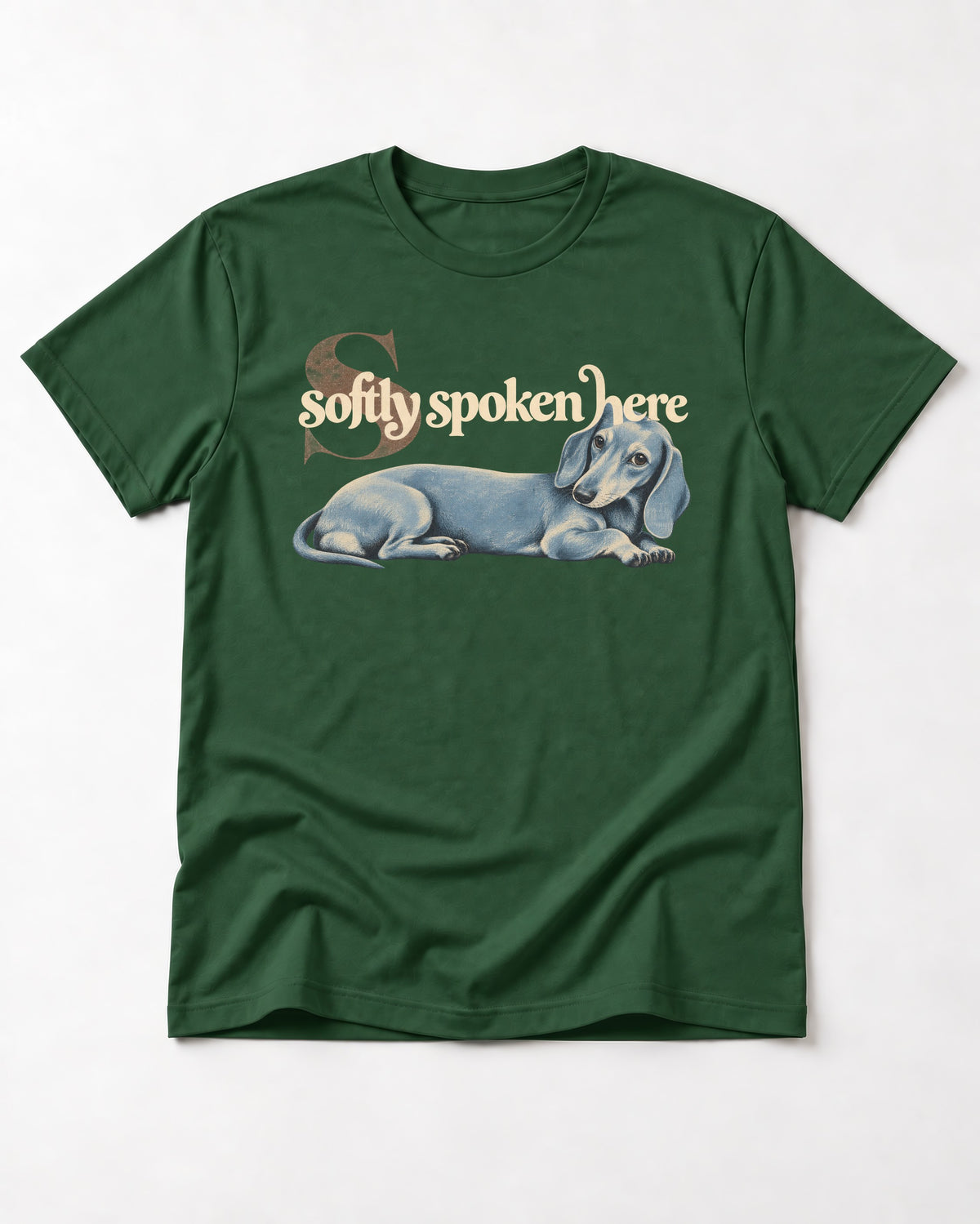 Dachshund Softly Spoken Here Reclining Portrait Graphic T-Shirt in Forest Green, flat lay product photo