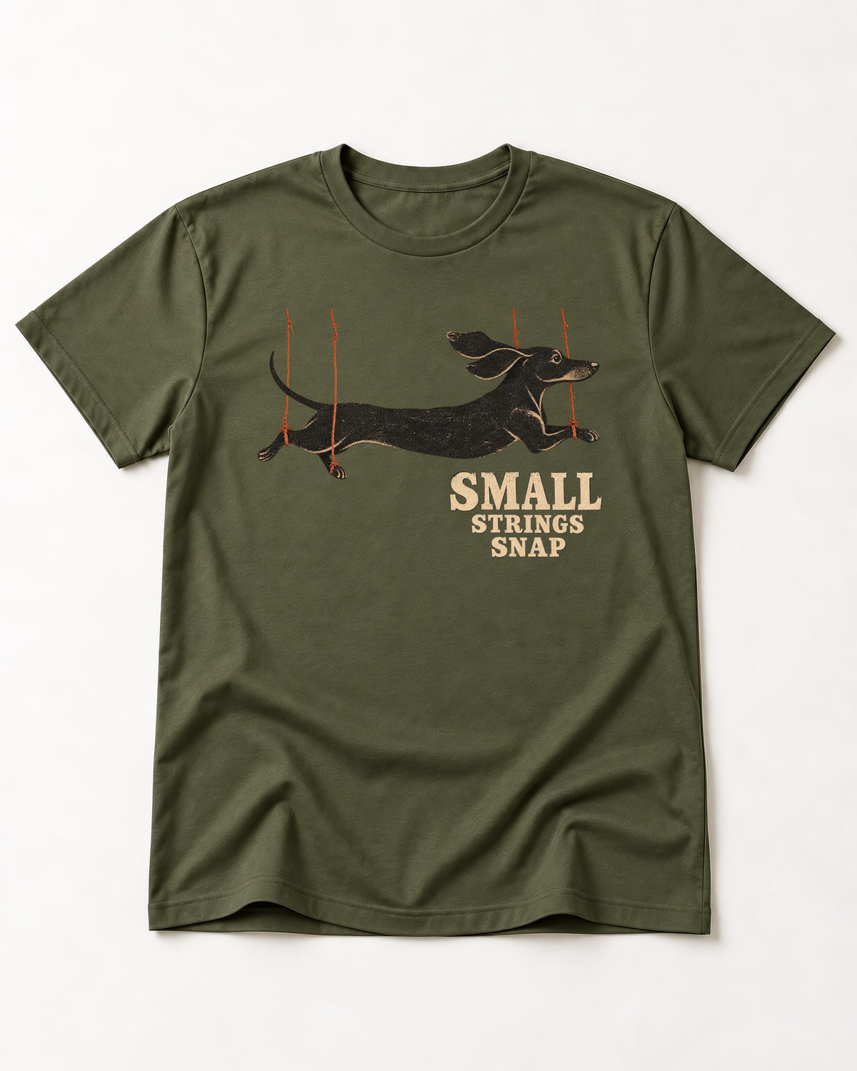 Dachshund Small Strings Snap Marionette Graphic T-Shirt in Heather Military Green, flat lay product photo
