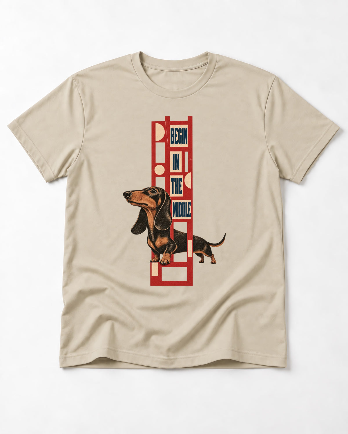 Dachshund Begins in the Middle T-Shirt in Sand, flat lay product photo