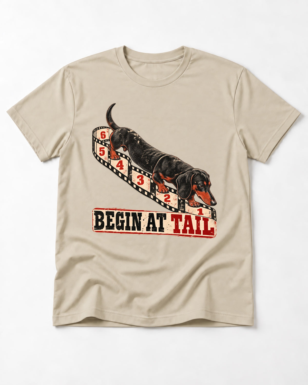 Begin at Tail Dachshund T-Shirt in Sand, flat lay product photo