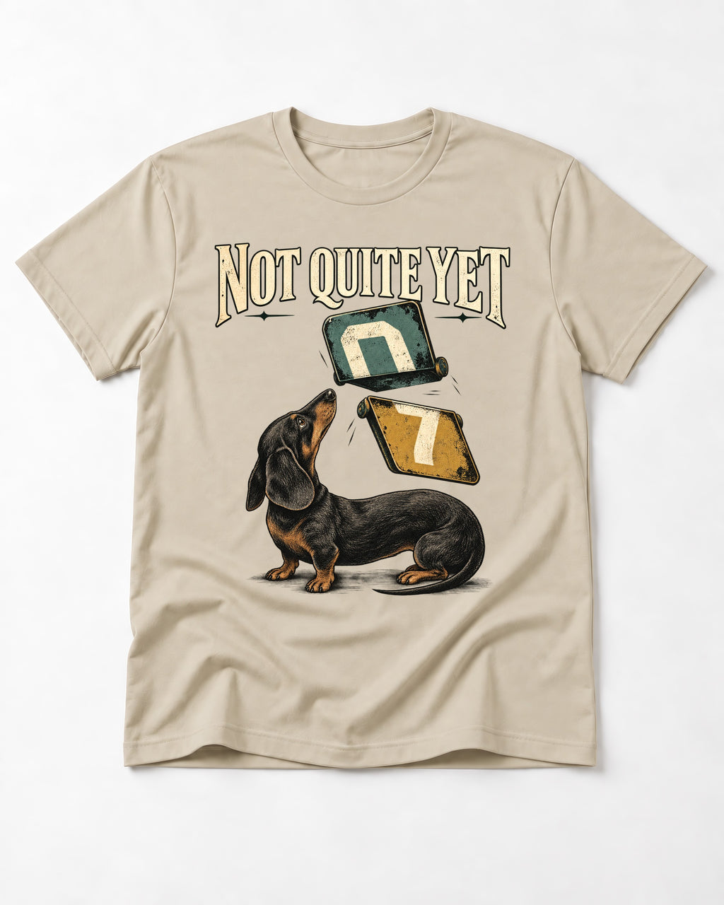 Not Quite Yet Dachshund T-Shirt in Sand, flat lay product photo