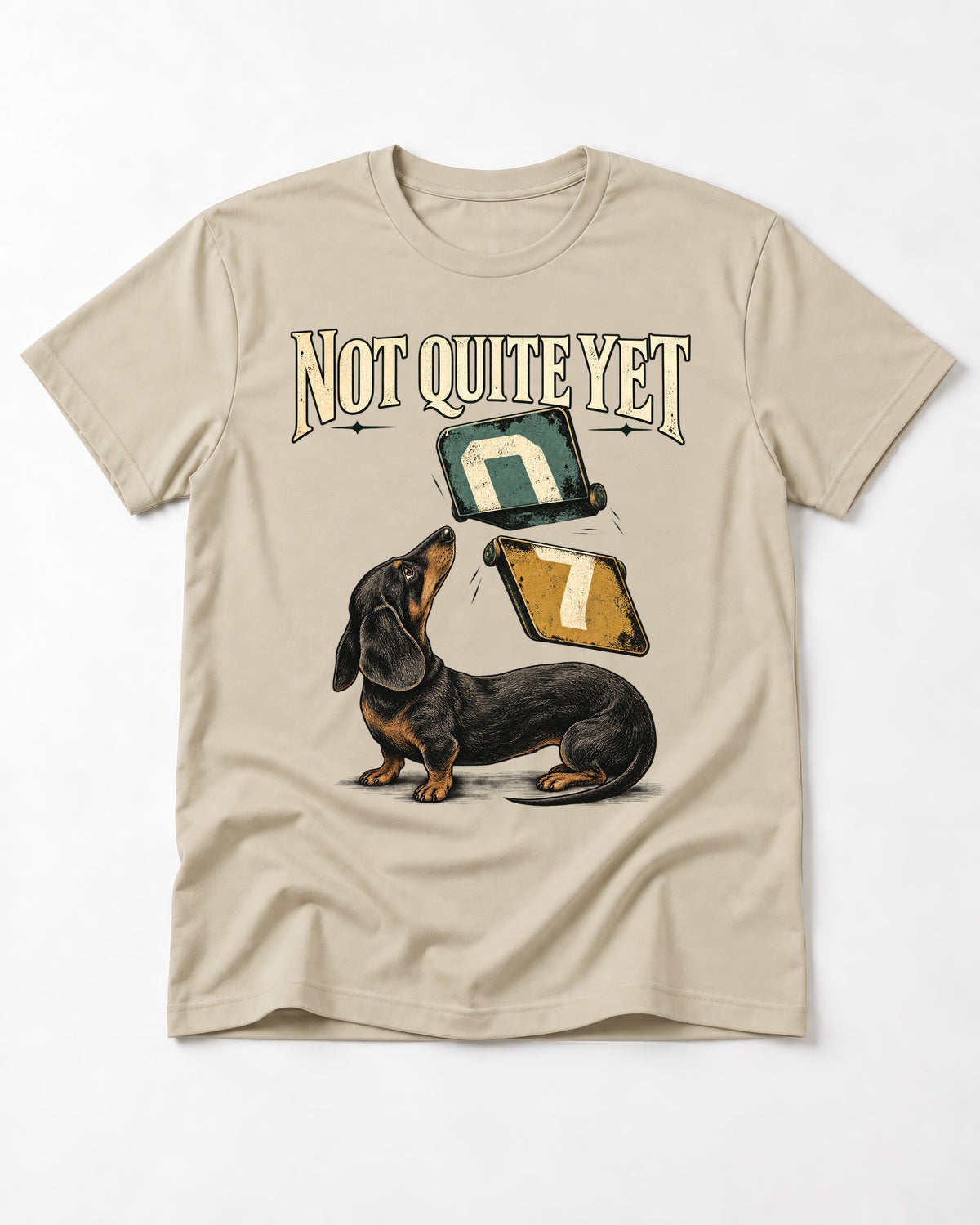 Not Quite Yet Dachshund T-Shirt in Sand, flat lay product photo