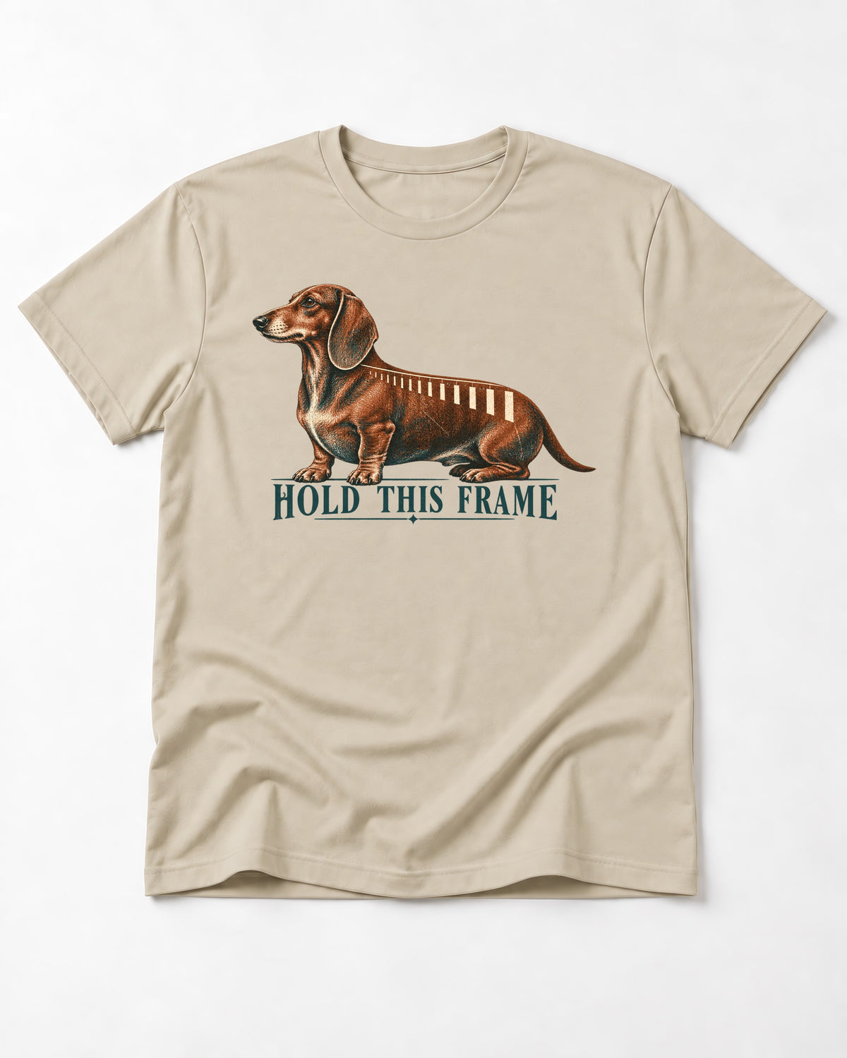 Dachshund Hold This Frame T-Shirt in Sand, flat lay product photo