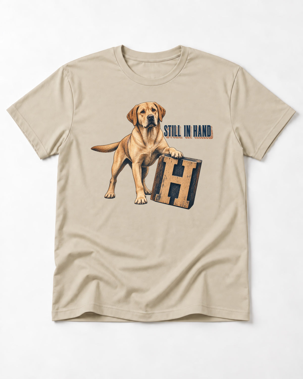 Labrador Retriever Still in Hand T-Shirt in Sand, flat lay product photo