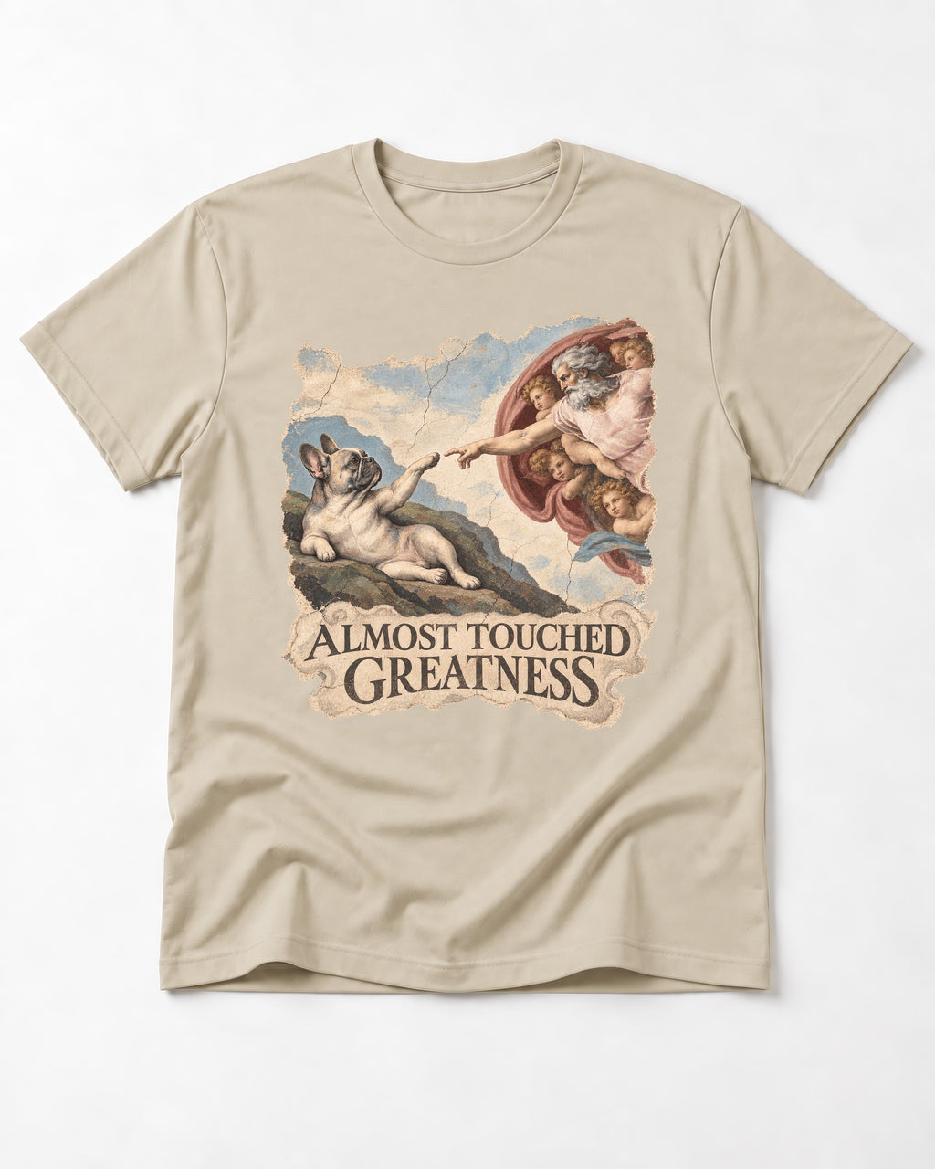 Frenchie Almost Touched Greatness T-Shirt in Sand, flat lay product photo