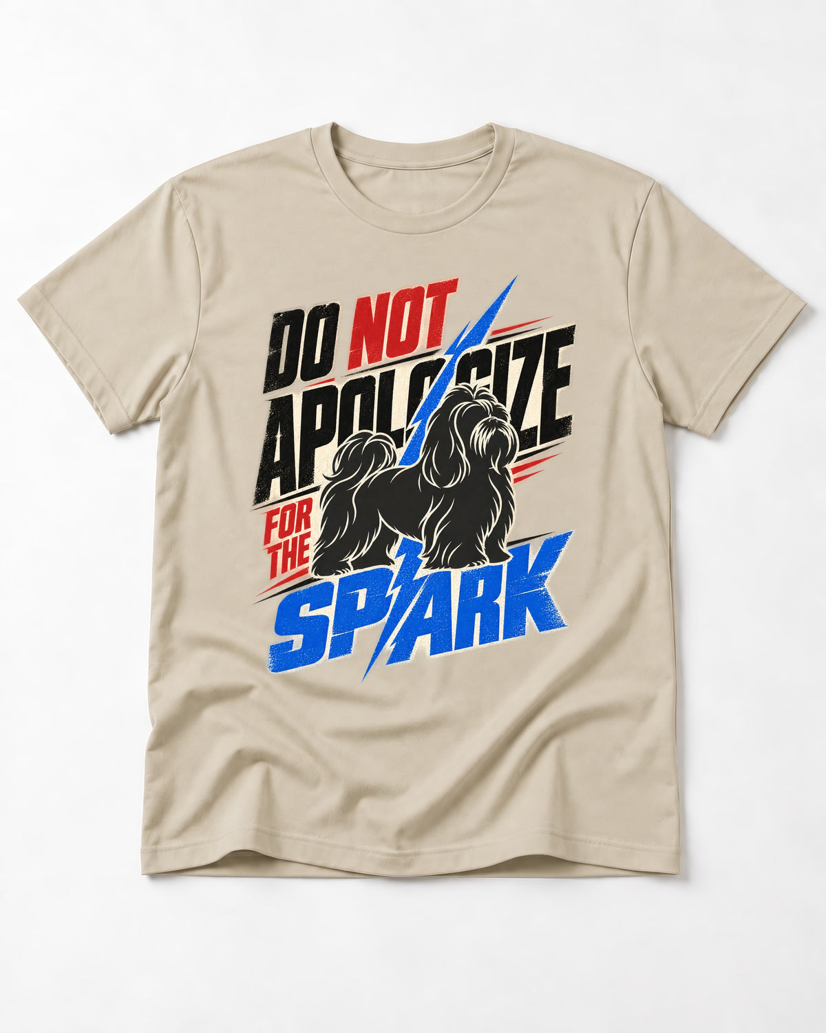 Never Apologize for Shih Tzu Spark T-Shirt in Sand, flat lay product photo